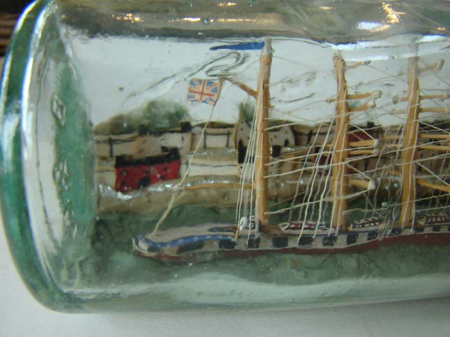A Wonderful Antique Ship-in-a Bottle being lead into harbor by a pilot boat circa 1900 — image 4